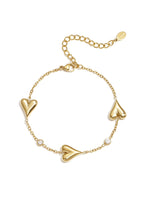 Armband met hartjes en strass steentjes, goudkleurig