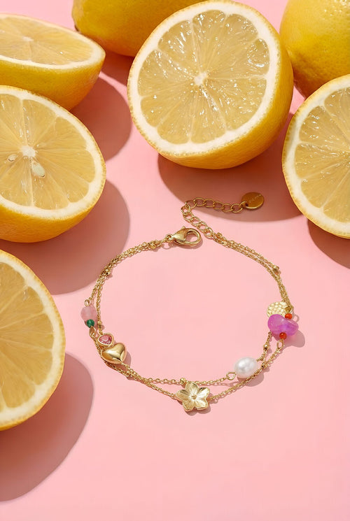 Bedelarmband met hart en bloem, detailfoto