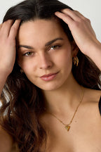 Bolletjes ketting met een klein hartje - Jewellery Fever