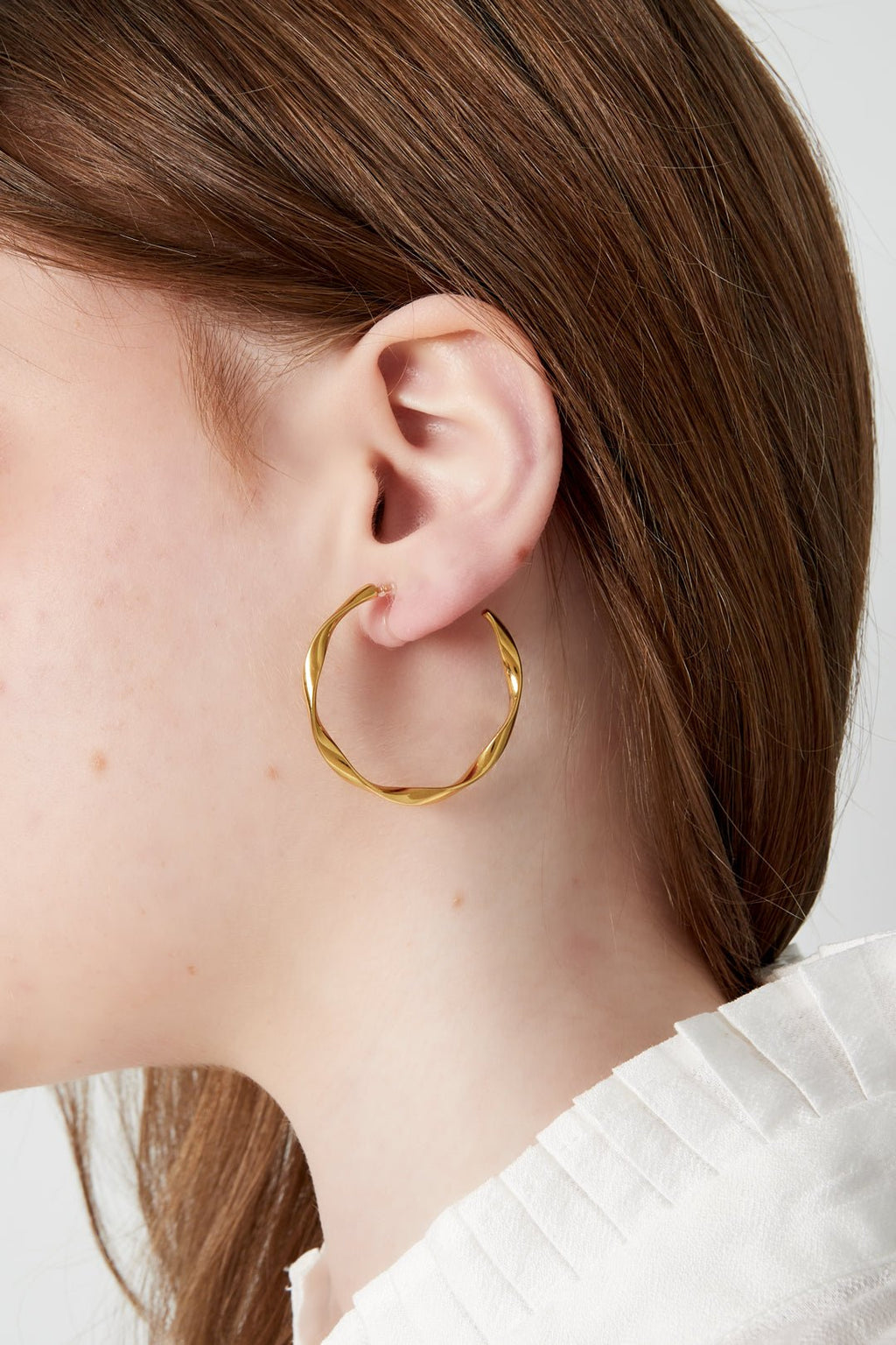 Clip oorbellen met gedraaid design - Jewellery Fever