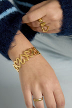 Speelse armband met open hartjes - Jewellery Fever